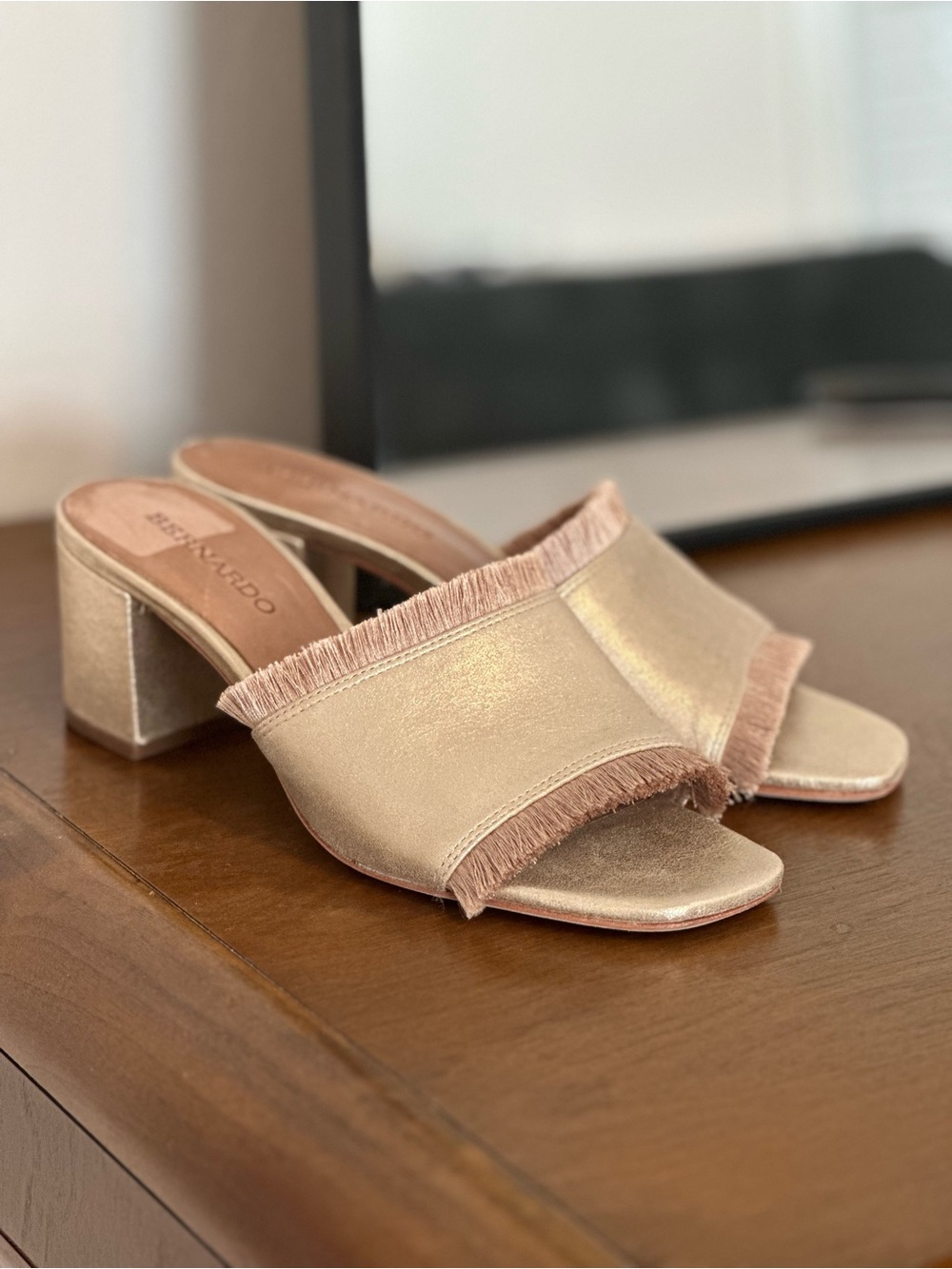 Bernardo Metallic Fringe Slide Mules in Gold